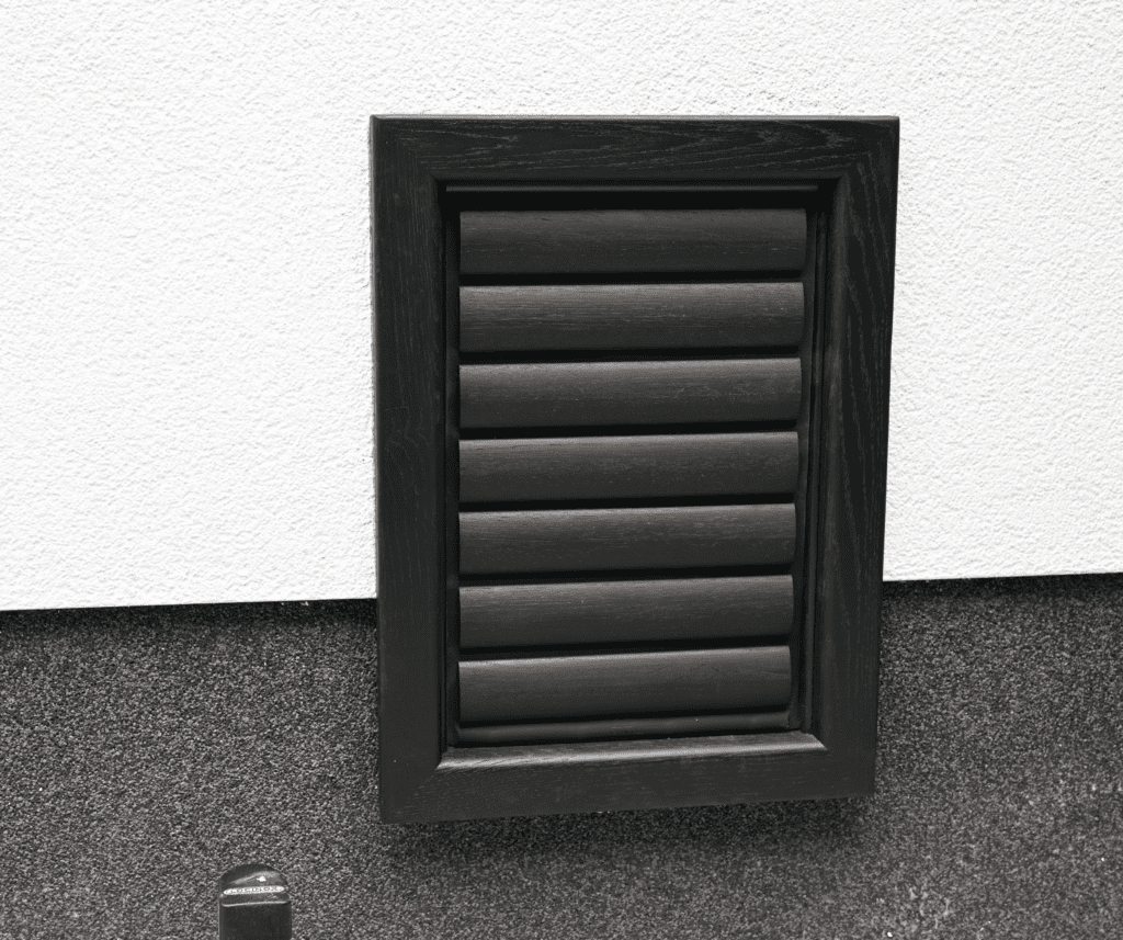 Black cat flap and black dog door installed in a wall - Tomsgates cat door, Tomsgates dog door, High-quality cat flap, Draught-free cat flap, Secure cat flap, Silent cat flap, Wooden cat flap